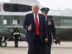 U.S. President Donald Trump is accompanied by Colonel Rebecca Sonkiss while walking from the Marine One helicopter to board Air Force One as he departs Washington for travel to Dallas, Texas at Joint Base Andrews, Maryland, U.S., June 11, 2020. REUTERS/Jonathan Ernst