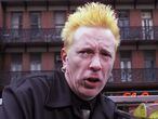 NEW YORK, NY - [October 2000]: John Lydon aka Johnny Lydon of the Sex Pistols and Public Image Limited holds tribute to the memory of former Sex Pistol bass player, Sid Vicious in front of The Chelsea Hotel where Sid died. This took place in October 2000 in New York City. (Photo by Bill Tompkins/Getty Images)