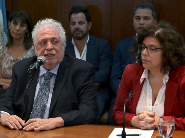 (FILES) In this file photo taken on March 3, 2020 Argentina's (then) Health Minister Gines Gonzalez Garcia (C) speaks next to the Secretary of Health Access Carla Vizzotti during a press conference in Buenos Aires in which he confirmed the first case of the novel coronavirus, COVID-19, in the country. - Vizzotti was named as health minister on February 19, 2021 replacing Gines Gonzales who resigned following a request by Argentine President Alberto Fernandez after it emerged that people close to him had skipped the line for a COVID-19 vaccination. (Photo by Juan MABROMATA / AFP)