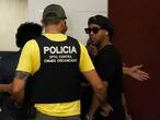 Former Brazilian soccer star Ronaldinho, or Ronaldo de Assis Moreira, right, enters Paraguay's attorney offices in Asuncion, Paraguay, Thursday, March 5, 2020. According to local news, Ronaldinho is accused of arriving in the country with a fake Paraguay passport. (AP Photo/Jorge Saenz)