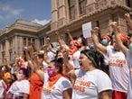 FILE - In this Sept. 1, 2021 file photo, women protest against the six-week abortion ban at the Capitol in Austin, Texas. Even before a strict abortion ban took effect in Texas this week, clinics in neighboring states were fielding more and more calls from women desperate for options. The Texas law, allowed to stand in a decision Thursday, Sept. 2, 2021 by the U.S. Supreme Court, bans abortions after a fetal heartbeat can be detected, typically around six weeks. (Jay Janner/Austin American-Statesman via AP File)