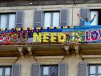 Milan (Italy), 28/03/2020.- A banner reading 'All You Need is Love' is seen at a balcony in Milan, Italy, during the country's lockdown following the COVID-19 new coronavirus pandemic, 28 March 2020. Italy is under lockdown in an attempt to stop the widespread of the SARS-CoV-2 coronavirus causing the Covid-19 disease. (Italia) EFE/EPA/PAOLO SALMOIRAGO