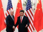 Chinese President Xi Jinping (R) shakes hands with U.S. Vice President Joe Biden (L) inside the Great Hall of the People in Beijing December 4, 2013. REUTERS/Lintao Zhang/Pool (CHINA - Tags: POLITICS)