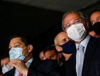 Brazil's Economy Minister Paulo Guedes wearing a protective face mask looks on next to President of the Senate Davi Alcolumbre during a news conference after a meeting to deliver the tax reform package at the National Congress in Brasilia, Brazil, July 21, 2020. REUTERS/Adriano Machado