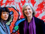 (FILES) This file photo taken on October 21, 2015 shows French researcher in Microbiology, Genetics and Biochemistry Emmanuelle Charpentier (L) and US professor of Chemistry and of Molecular and Cell Biology, Jennifer Doudna posing beside a painting made by children of the genoma at the San Francisco park in Oviedo. - Emmanuelle Charpentier of France and Jennifer Doudna of the US on Tuesday, October 7, 2020 won the Nobel Chemistry Prize for research into the gene-editing technique known as the CRISPR-Cas9 DNA snipping tool. (Photo by Miguel RIOPA / AFP)