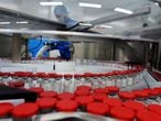 A picture taken on December 4, 2020 shows the production of Russia's Gam-COVID-Vac vaccine against the coronavirus disease (Covid-19) registered under trade name Sputnik V, developed by the Gamaleya Research Institute of Epidemiology and Microbiology in coordination with the Russian Defence Ministry, at the facility of Russia's biotech company BIOCAD in Strelna outside Saint Petersburg. (Photo by Olga MALTSEVA / AFP)