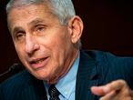 (FILES) In this file photo Anthony Fauci, director of the National Institute of Allergy and Infectious Diseases, speaks during a Senate Health, Education, Labor and Pensions Committee hearing in Washington, DC, on June 30, 2020. - The United States is still "knee-deep" in its first wave of coronavirus infections and must act immediately to tackle the recent surge, the country's top infectious diseases expert said July 6, 2020. Anthony Fauci said the number of cases had never reached a satisfactory baseline before the current resurgence, which officials have warned risks overwhelming hospitals in the country's south and west. (Photo by Al Drago / various sources / AFP)