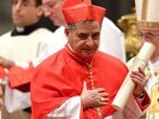 (FILES) In this file photo taken on June 28, 2018 Italian Giovanni Angelo Becciu, substitute for General Affairs of the Secretariat of State and special delegate to the Sovereign Military Order of Malta, leaves after kneeling before Pope Francis to pledge allegiance and become a cardinal during a consistory for the creation of fourteen new cardinals on June 28, 2018 at St Peter's basilica in the Vatican. - Cardinal Angelo Becciu, the head of the vatican's saint-making office, resigned, the Vatican said in a statement on September 24, 2020. Becciu was reportedly indirectly implicated in a financial scandal involving the Vatican�s investment in a London real estate deal. (Photo by Andreas SOLARO / AFP)