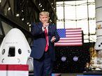 President Donald Trump points to Elon Musk as he arrives to speak after viewing the SpaceX flight to the International Space Station, at Kennedy Space Center, Saturday, May 30, 2020, in Cape Canaveral, Fla. (AP Photo/Alex Brandon)