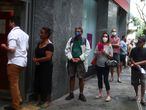 People wait in line to enter a bank during the outbreak of the coronavirus disease (COVID-19), in the Copacabana neighbourhood in Rio de Janeiro, Brazil April 9, 2020. REUTERS/Pilar Olivares