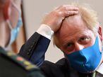 Britain's Prime Minister Boris Johnson talks with a paramedic as he visits headquarters of the London Ambulance Service NHS Trust, amid the spread of the coronavirus disease (COVID-19), in London, Britain July 13, 2020. Ben Stansall/Pool via REUTERS