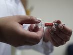 A nurse holds the China’s SinoVac coronavirus potential vaccine for trials before administering it to a volunteer at Emilio Ribas Institute in Sao Paulo, Brazil July 30, 2020. Picture taken July 30, 2020. REUTERS/Amanda Perobelli
