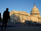 People walk by the U.S. Capitol in Washington Saturday Nov. 7, 2020. (AP Photo/Steve Helber)