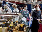 FILE PHOTO: People wear protective masks while shopping at an open-air market as France reinforces mask-wearing as part of efforts to curb a resurgence of the coronavirus disease (COVID-19) across the country, in Paris, France, August 29, 2020.  REUTERS/Charles Platiau/File Photo