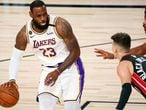 Oct 11, 2020; Lake Buena Vista, Florida, USA; Los Angeles Lakers forward LeBron James (23) dribbles while defended by Miami Heat guard Tyler Herro (14) during the first quarter in game six of the 2020 NBA Finals at AdventHealth Arena. Mandatory Credit: Kim Klement-USA TODAY Sports