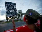 A supporter of Brazil's former President Luiz Inacio Lula da Silva takes part in a protest in front of the Supreme Court in Brasilia, Brazil, April 15, 2021. REUTERS/Adriano Machado