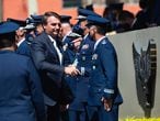 BRASILIA, BRAZIL - JANUARY 20: Jair Bolsonaro, President of Brazil, greets military aeronautics before the Air Force 80th Anniversary Celebration amidst the Coronavirus (COVID - 19) pandemic at the Brazilian Air Force Base on January 20, 2021 in Brasilia. Brazil has over 8.570,000 confirmed positive cases of Coronavirus and has over 211,491 deaths. (Photo by Andressa Anholete/Getty Images)