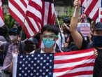 CENTRAL, HONG KONG, CHINA - 2019/09/08: Protesters wave dozens of American flags while chanting various slogans during the demonstration.
Thousands of protesters marched to the U.S. Consulate General in support of the Hong Kong Human Right Acts. Protesters waved American flags, exhibited various placards and shouted slogans asking for U.S. involvement. Violence eventually broke out as protesters vandalized certain MTR station entrances, while police later conducted a dispersal operation. (Photo by Aidan Marzo/SOPA Images/LightRocket via Getty Images)