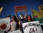 Demostrators take part in a protest against Brazil's President Jair Bolsonaro and his handling of the coronavirus disease (COVID-19) outbreak in Brasilia, Brazil January 24, 2021. REUTERS/Adriano Machado