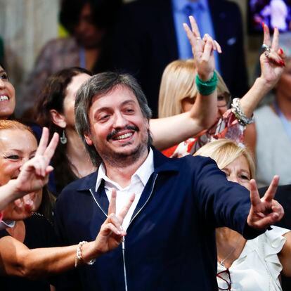 Congressman Maximo Kirchner, center, son of Vice President Cristina Fernandez, flashes a victory sign alongside other lawmakers at Congress as they wait for the arrival of Argentina's President Alberto Fernandez in Buenos Aires, Argentina, Sunday, March 1, 2020. (AP Photo/Marcos Brindicci)