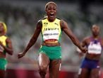 Tokyo 2020 Olympics - Athletics - Women's 100m - Final - OLS - Olympic Stadium, Tokyo, Japan - July 31, 2021. Elaine Thompson-Herah of Jamaica celebrates crossing the finish line to win gold REUTERS/Hannah Mckay     TPX IMAGES OF THE DAY