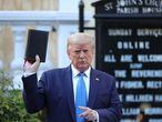 U.S. President Donald Trump holds up a Bible during a photo opportunity in front of St. John's Episcopal Church in the midst of ongoing protests over racial inequality in the wake of the death of George Floyd while in Minneapolis police custody, outside the White House in Washington, U.S., June 1, 2020. REUTERS/Tom Brenner