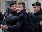FILE - In this March 26, 2017, file photo, police detain journalist Raman Pratasevich, center, in Minsk, Belarus. Thousands of Belarusians who have fled the former Soviet nation for other European countries amid a brutal crackdown on dissent are shocked by the forced diversion of a passenger jet. Pratasevich, an opposition journalist who lived abroad, was on the flight and was arrested when the plane landed in Minsk on Sunday, May 23, 2021. (AP Photo/Sergei Grits, File)