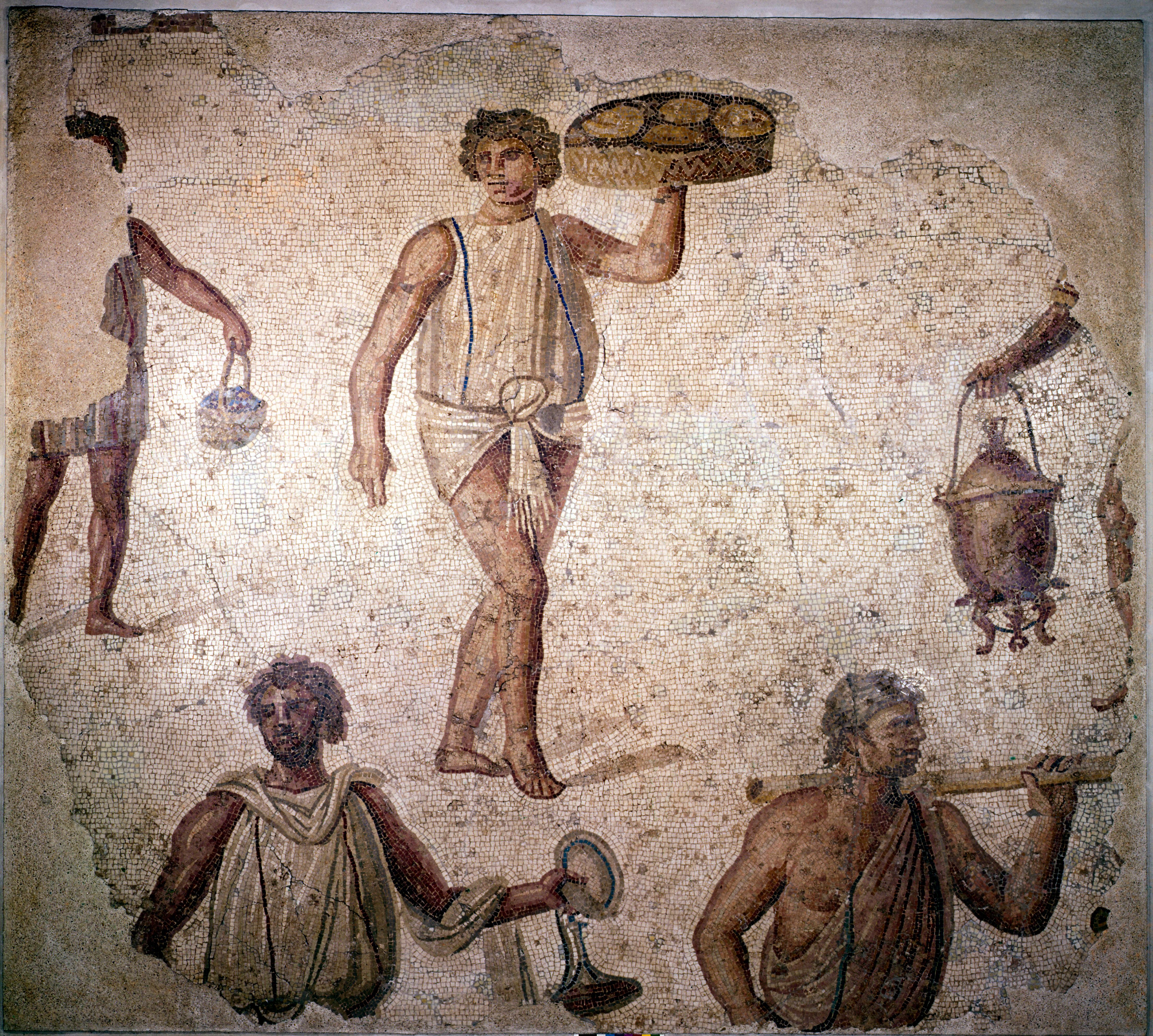 Cena de escravos preparando um banquete em um mosaico conservado em Cartago (Tunísia).
