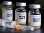FILE PHOTO: Small bottles labeled with a "Vaccine COVID-19" sticker and a medical syringe are seen in this illustration taken taken April 10, 2020. REUTERS/Dado Ruvic/Illustration/File Photo