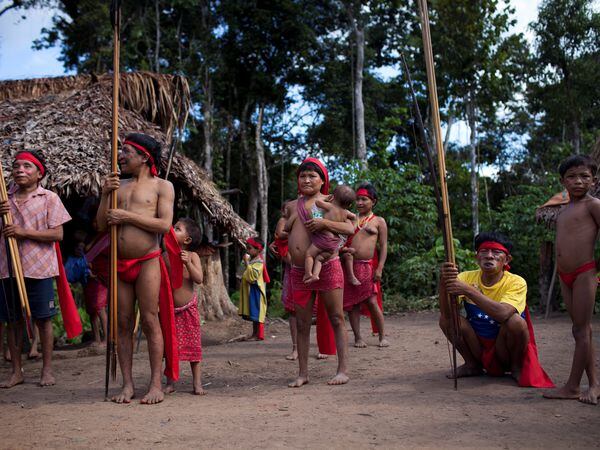FILE PHOTO: Yanomami Indians perform a dance at the community of Irotatheri, during a government trip for journalists, in the southern Amazonas state of Venezuela, just 19km (12 miles) from Brazil's border, September 7, 2012. REUTERS/Carlos Garcia Rawlins/File Photo