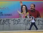 A man walks by a billboard showing Nicaragua's President Daniel Ortega and Vice President Rosario Murillo in Managua, Nicaragua June 21, 2021. Picture taken June 21, 2021. REUTERS/Stringer NO RESALES. NO ARCHIVES